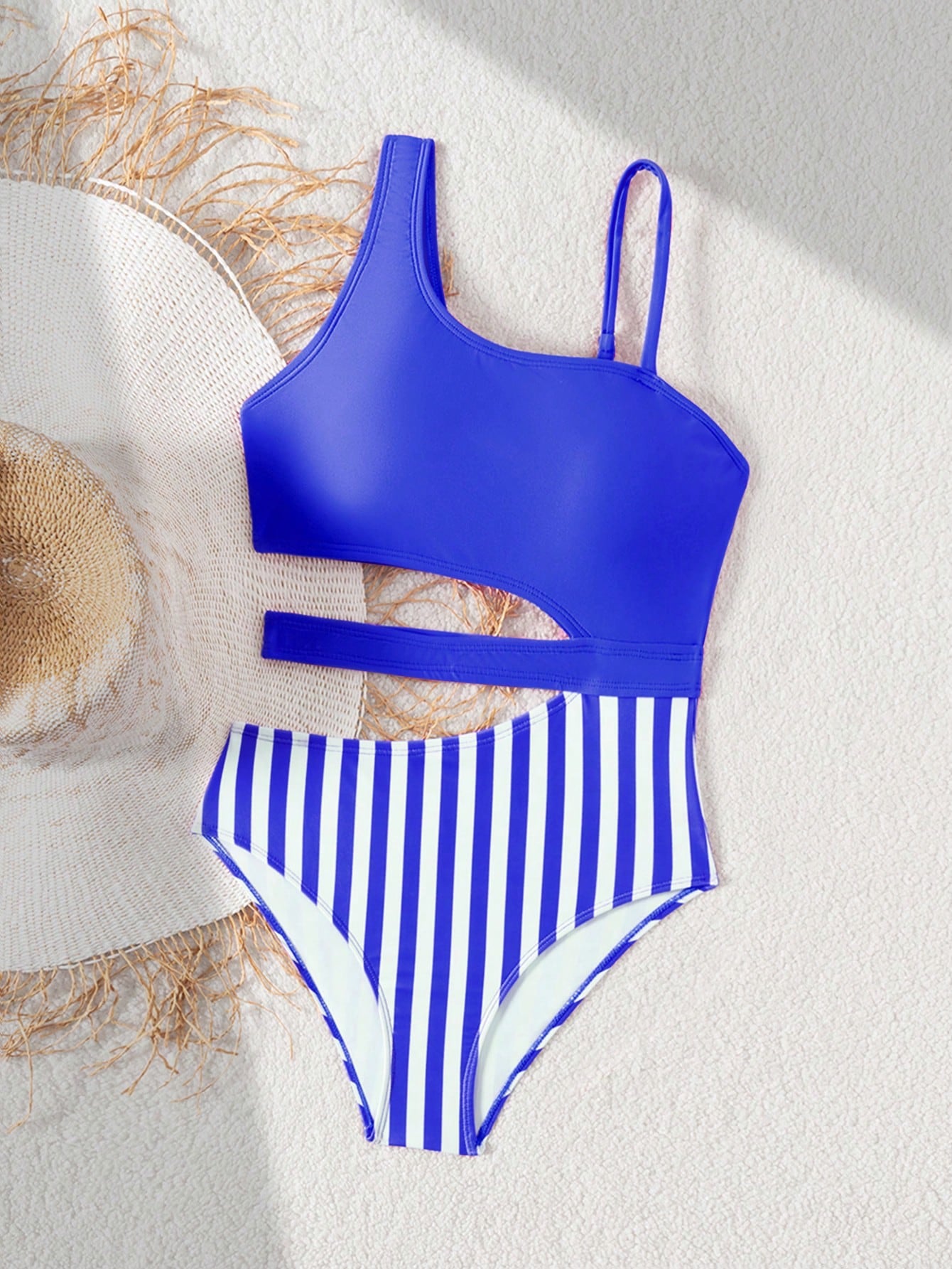 Purple tween girls one-piece swimsuit with asymmetrical neckline, cut-out waist, striped pattern, fitted silhouette, and lined body.
