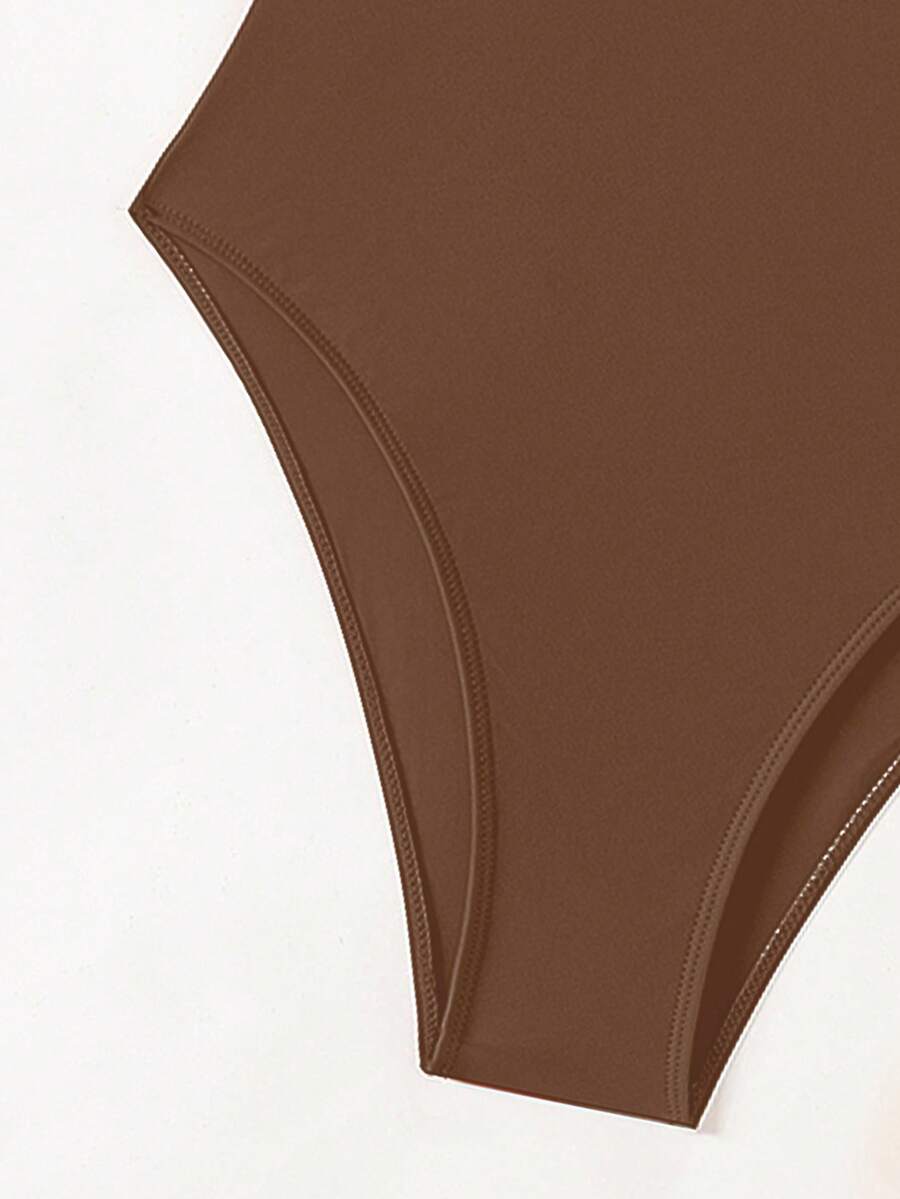 Women's solid color one-piece swimsuit featuring a backless scoop neck design and high cut fit