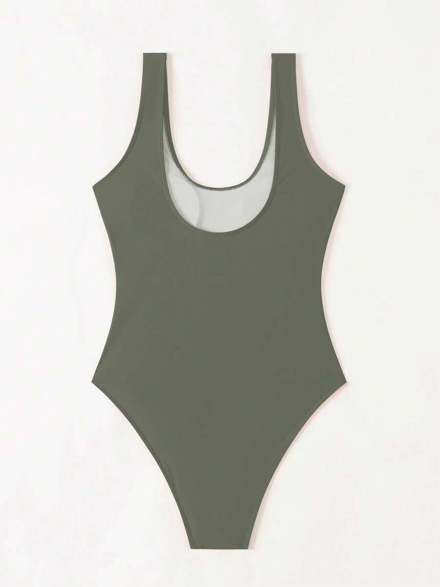 Women's solid color one-piece swimsuit featuring a backless scoop neck design and high cut fit