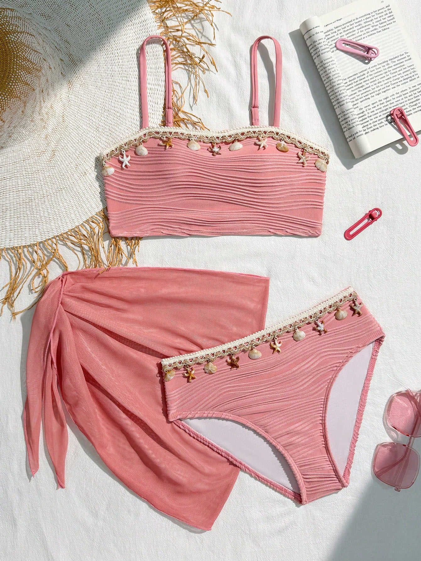 Tween girls bikini set with shell and starfish woven band details, spaghetti strap sleeveless top, and mid-waist skirt-style bottom in blue.