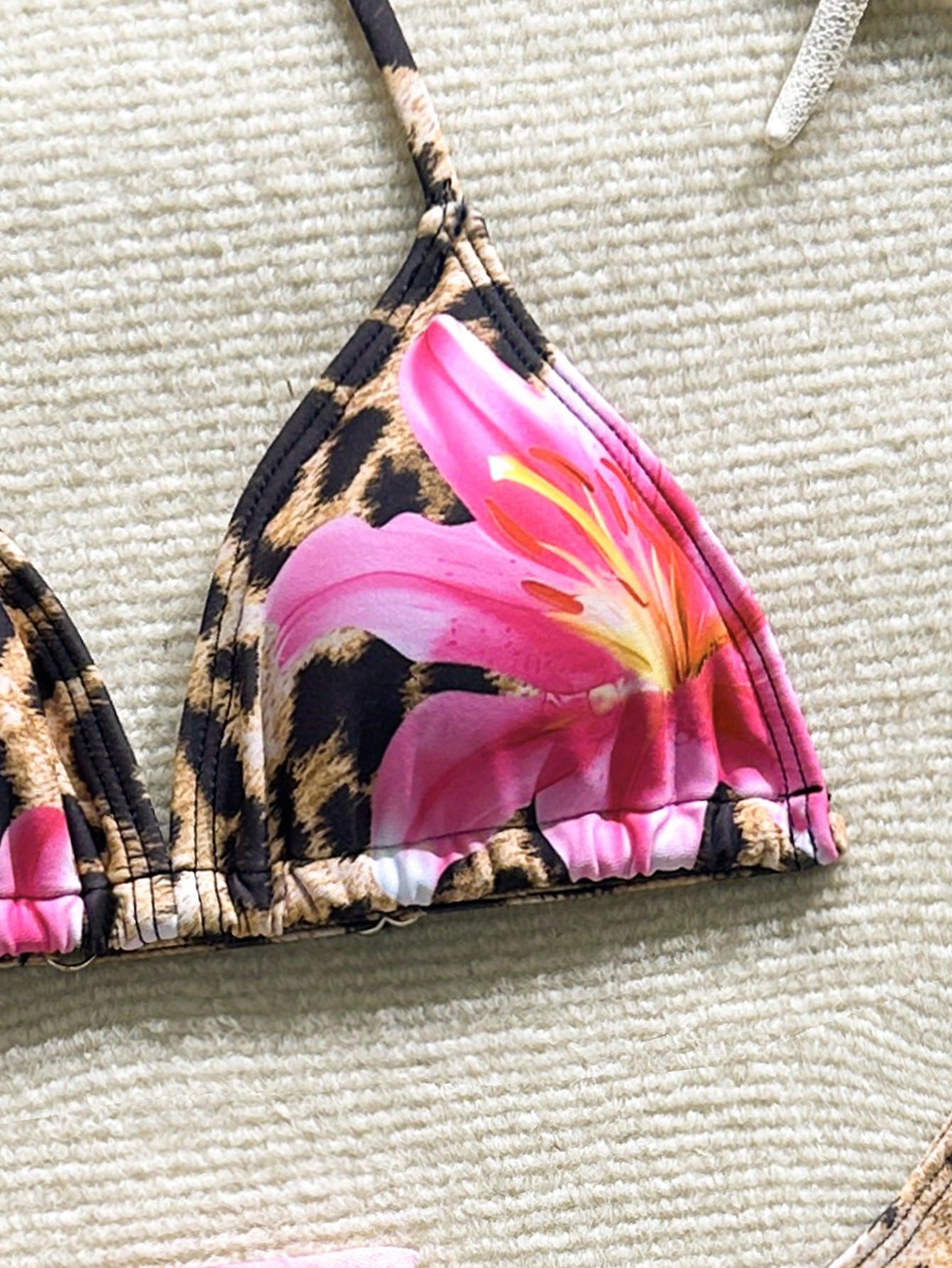 Tween girls 3-piece swimwear set in pink featuring a striped triangle halter bikini top with bow detail and adjustable neck and back ties, an adjustable mid-waist bikini bottom, and a sheer pink mesh skirt cover-up for beach or pool wear.