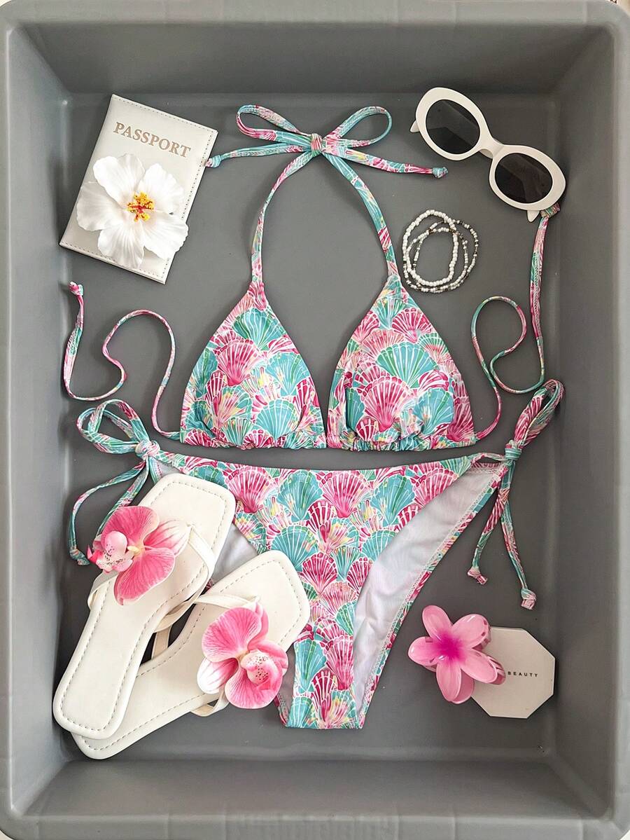 Women's black and white zebra print two-piece bikini set featuring a high waist tie-side bottom and a backless halter top with removable padding.