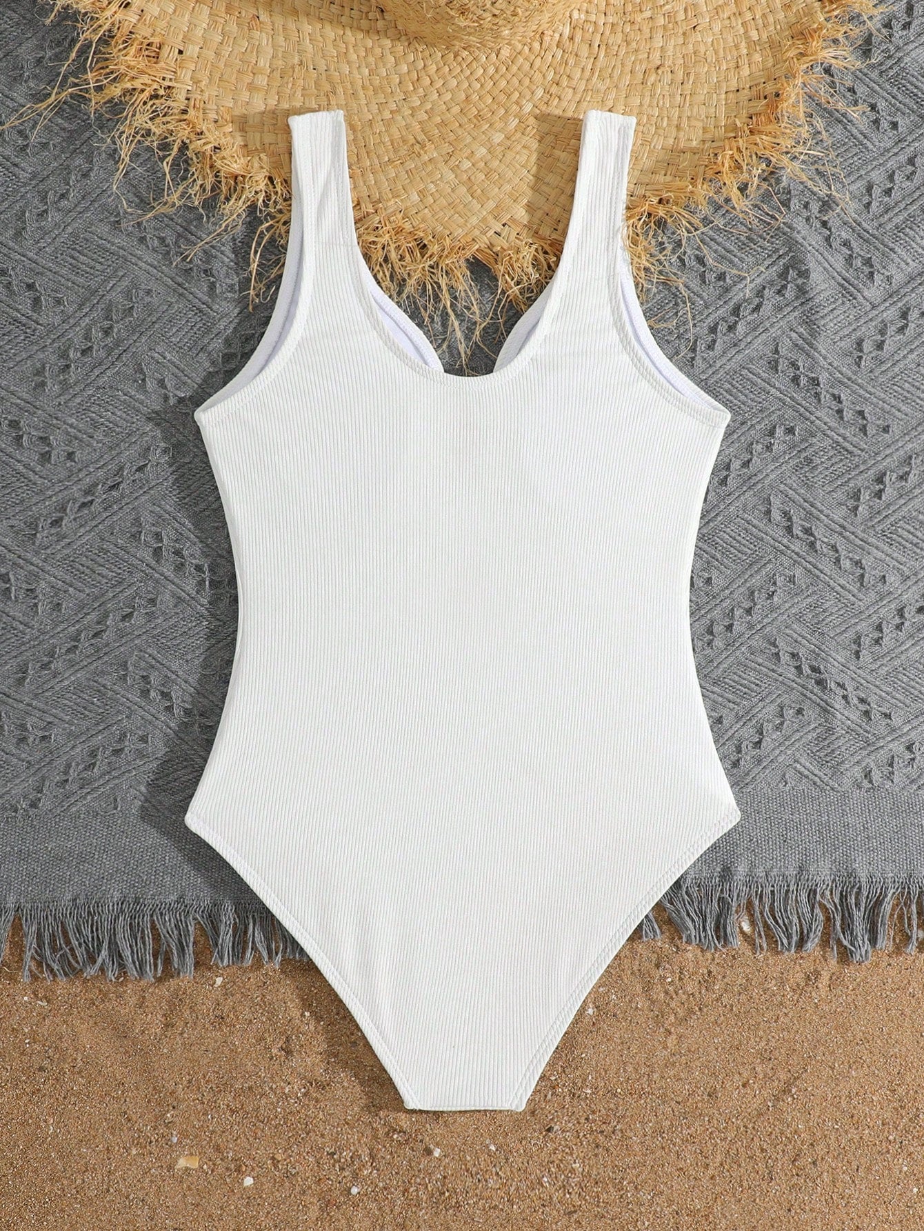 Purple rib knit one-piece swimsuit for tween girls with spaghetti straps, fitted shape, mid-waist bottom, wireless bra, and lined body.