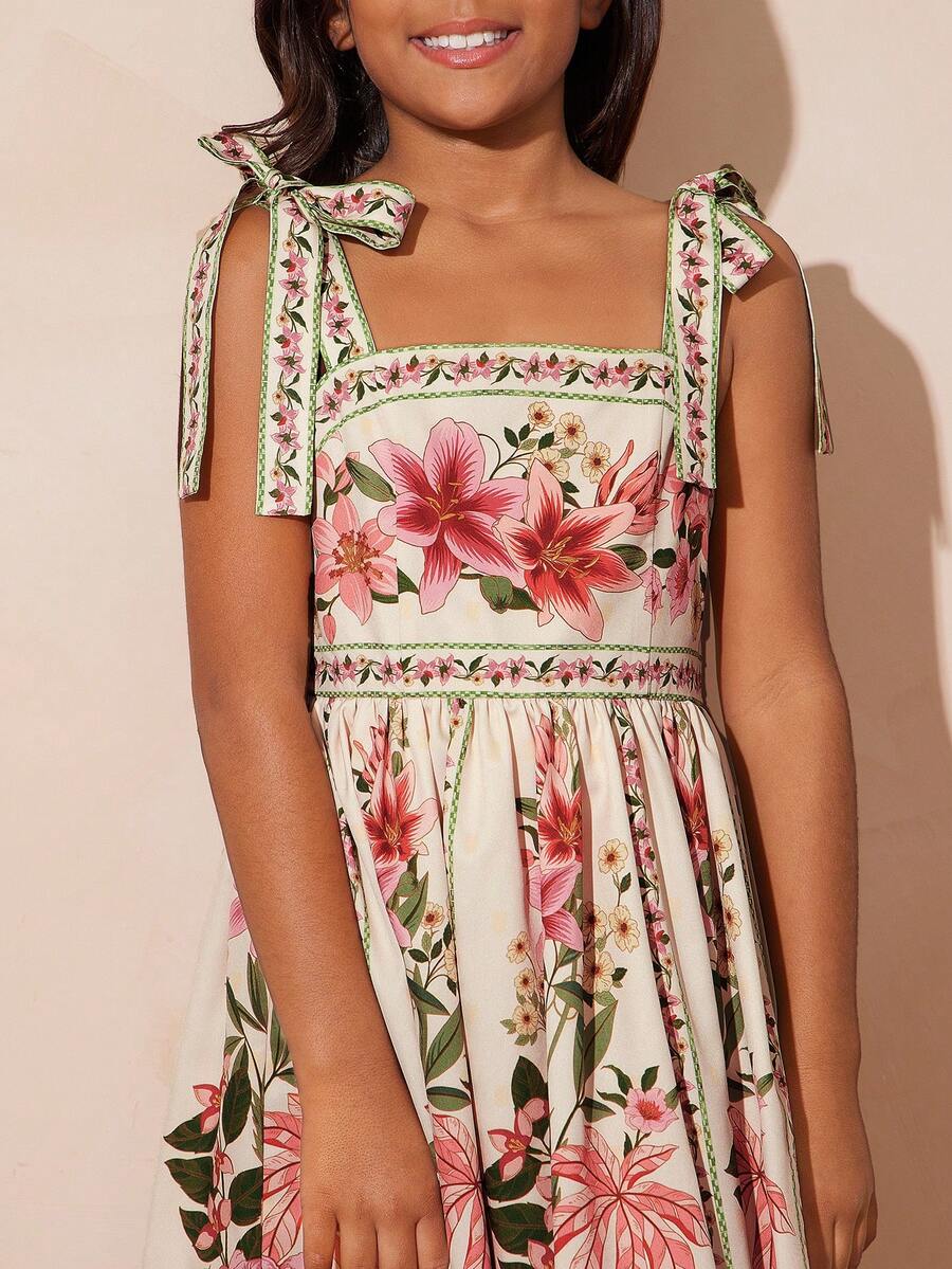 Girls multicolor floral print sundress with spaghetti straps, ruffle details, shirred accents, high waist, and flared A-line hem for vacation and everyday wear.