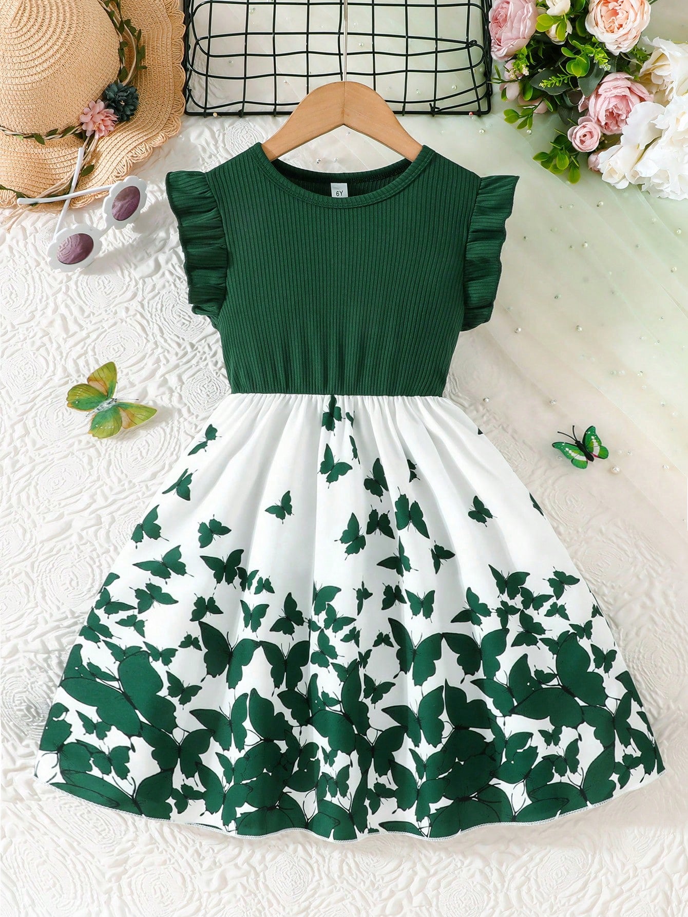 Tween girls blue floral print A-line midi dress featuring round neck, ruffle and contrast mesh details, high waist, and flared hem.