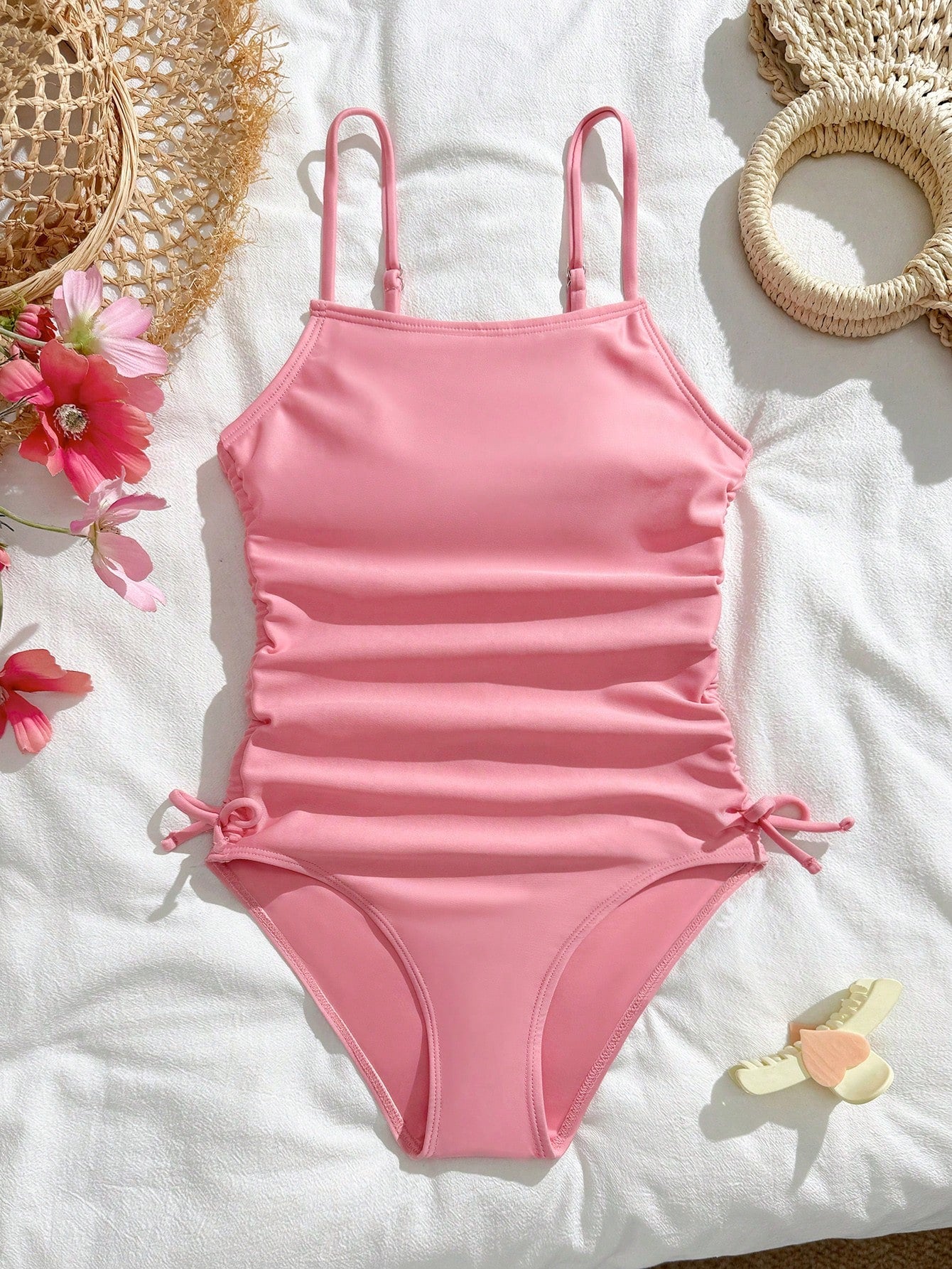 Purple rib knit one-piece swimsuit for tween girls with spaghetti straps, fitted shape, mid-waist bottom, wireless bra, and lined body.