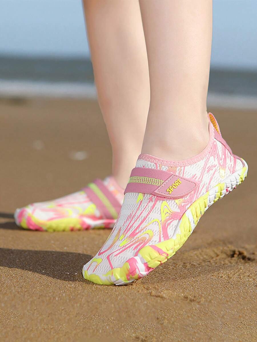 Children's water shoes featuring a breathable mesh upper, hook and loop closure, luminous details, and a non-slip outsole for boys and girls.
