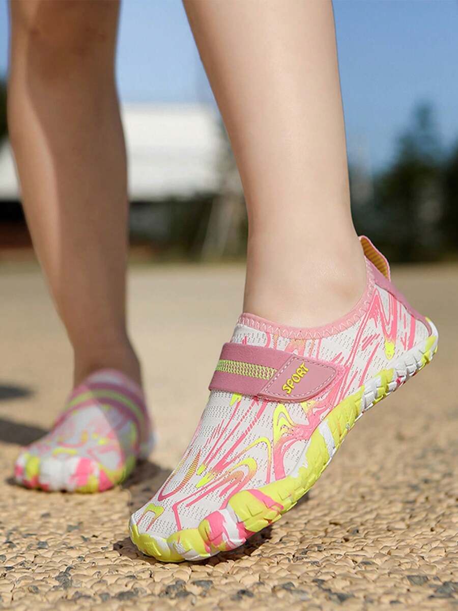 Children's water shoes featuring a breathable mesh upper, hook and loop closure, luminous details, and a non-slip outsole for boys and girls.