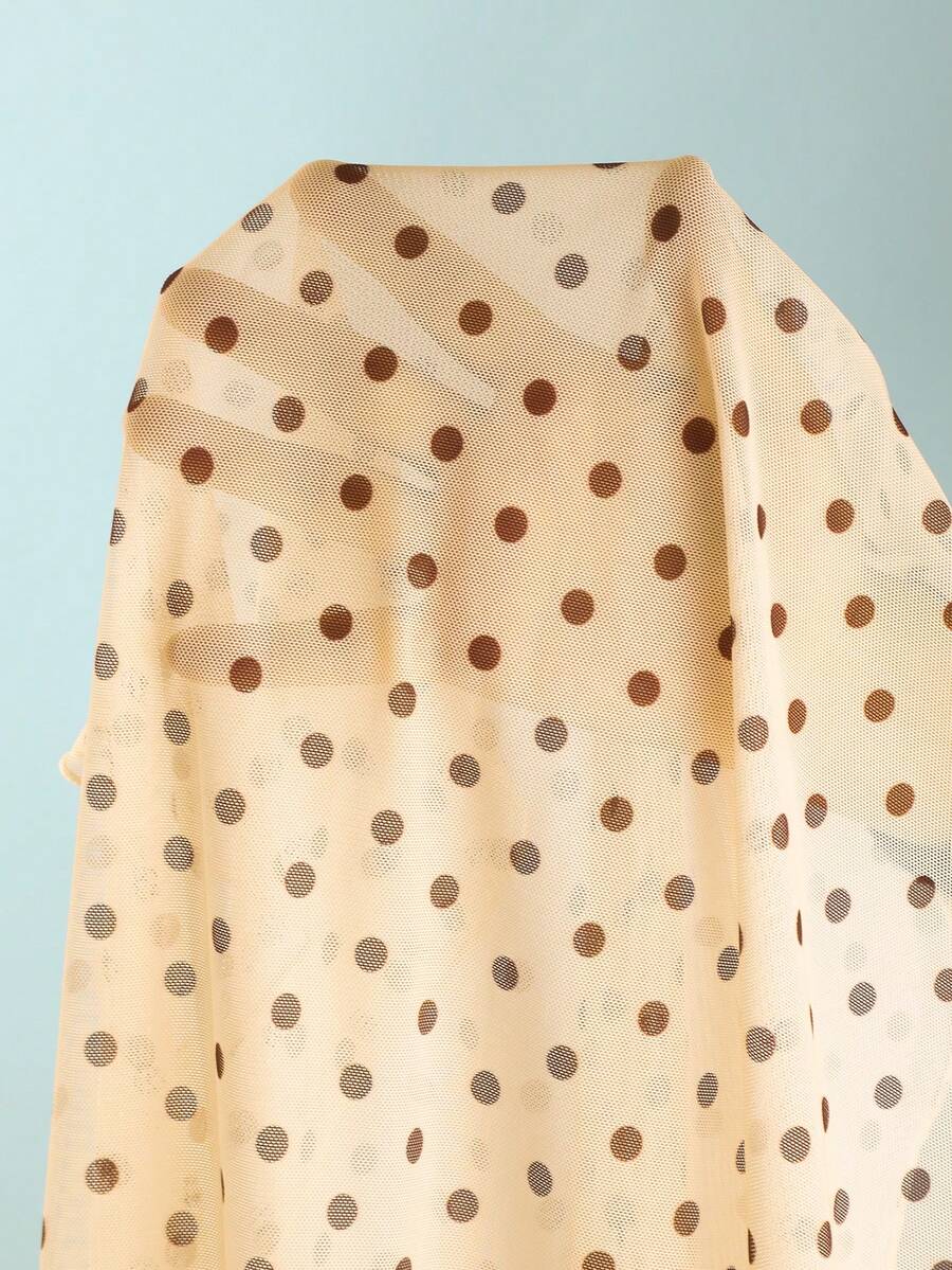 Women's apricot polka dot two-piece swimsuit featuring an asymmetrical halter backless top with knot tie detail and high-waisted bottoms.