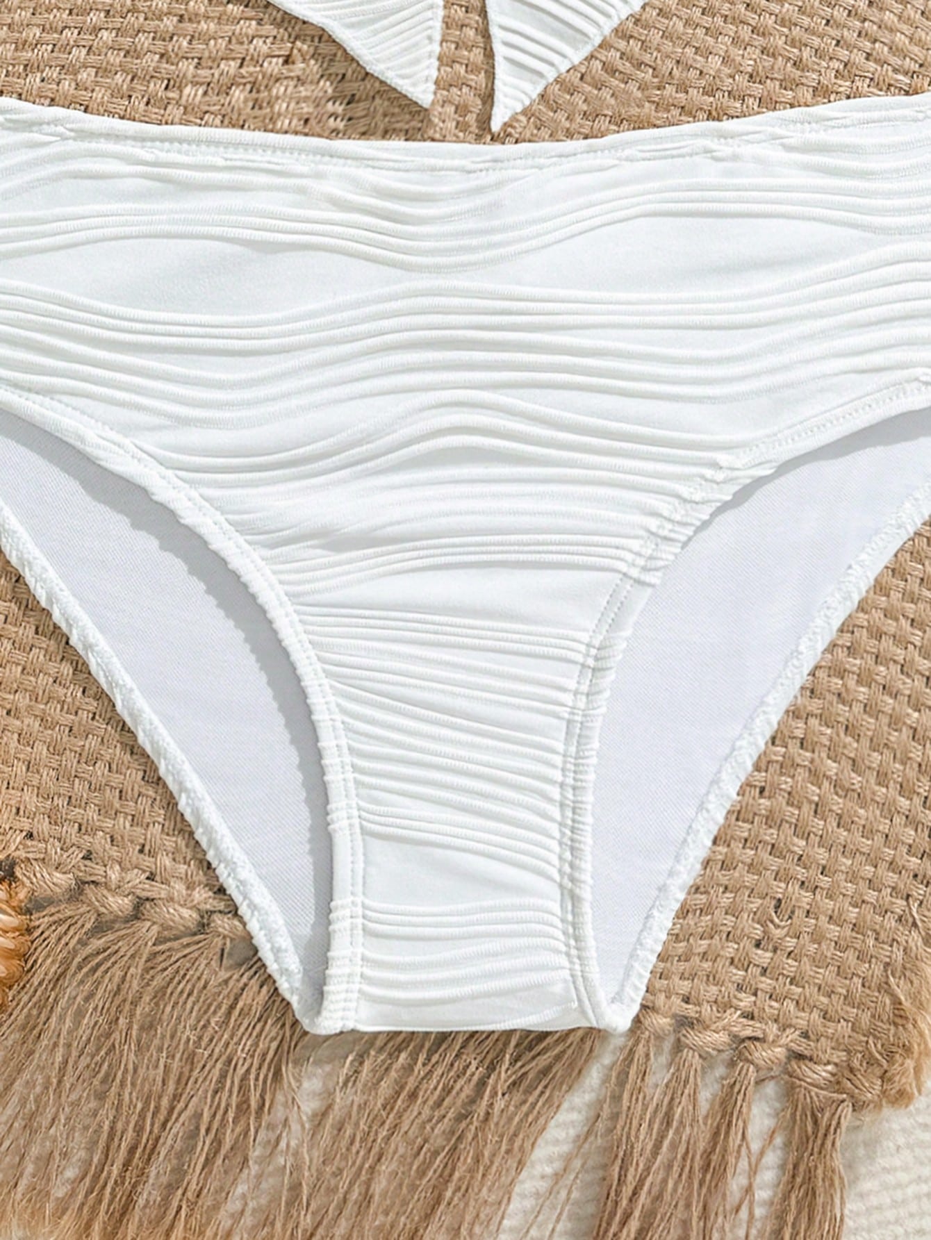 Tween girls 2-piece tankini swimwear set in apricot with a textured jacquard look, asymmetrical spaghetti-strap sleeveless top, and matching mid-waist short bikini bottoms.