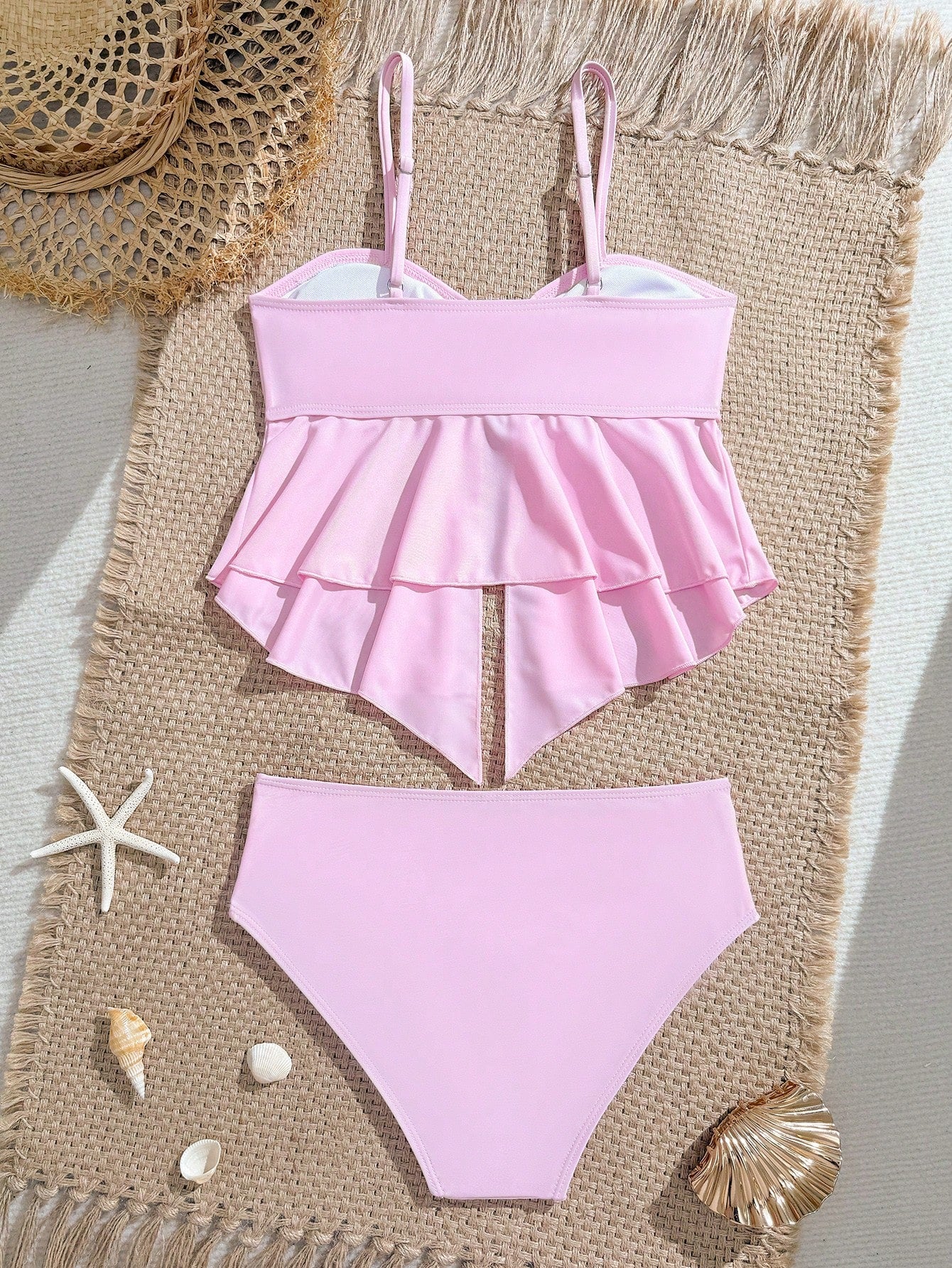 Tween girls 2-piece tankini swimwear set in apricot with a textured jacquard look, asymmetrical spaghetti-strap sleeveless top, and matching mid-waist short bikini bottoms.