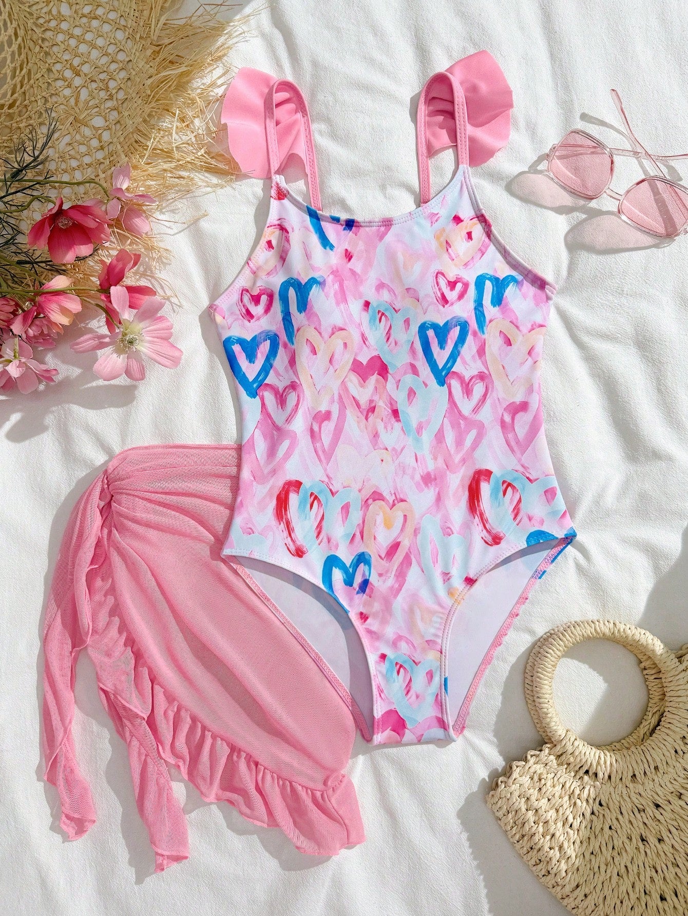 Tween girls one-piece swimsuit in leopard print with ruffle shoulder straps, scoop neckline, fitted shape, and attached ruffle hem skirt; sleeveless, mid-waist skirt bottom, and lined body for swimming, vacation, and summer beach wear.