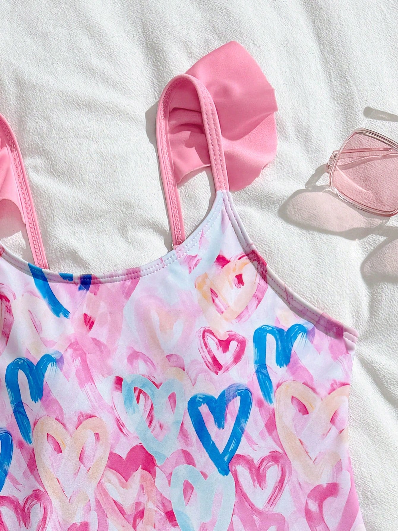 Tween girls one-piece swimsuit in leopard print with ruffle shoulder straps, scoop neckline, fitted shape, and attached ruffle hem skirt; sleeveless, mid-waist skirt bottom, and lined body for swimming, vacation, and summer beach wear.