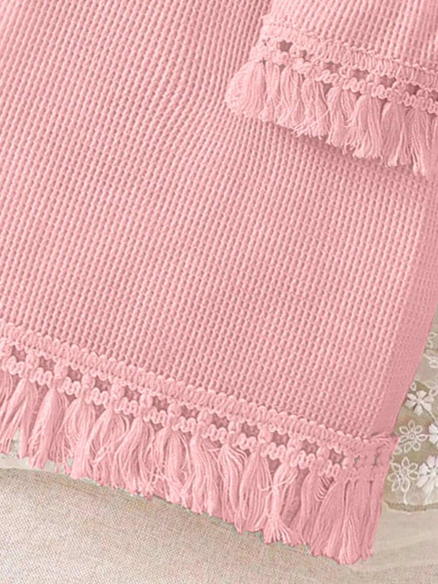 Girls' sleeveless summer midi dress with halter neckline, geometric pattern, applique and fringe details, shown with crossbody bag accessory with tassel decor