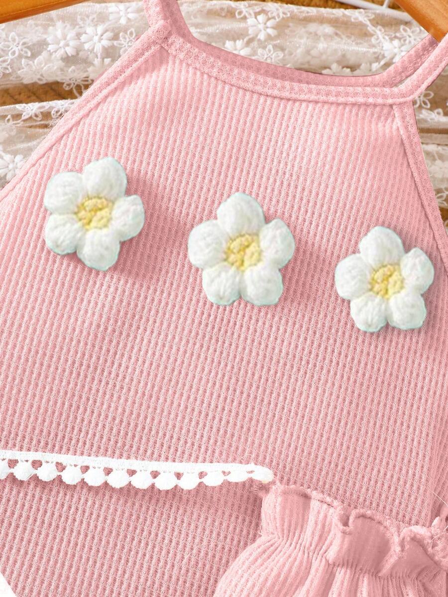 Girls' sleeveless summer midi dress with halter neckline, geometric pattern, applique and fringe details, shown with crossbody bag accessory with tassel decor