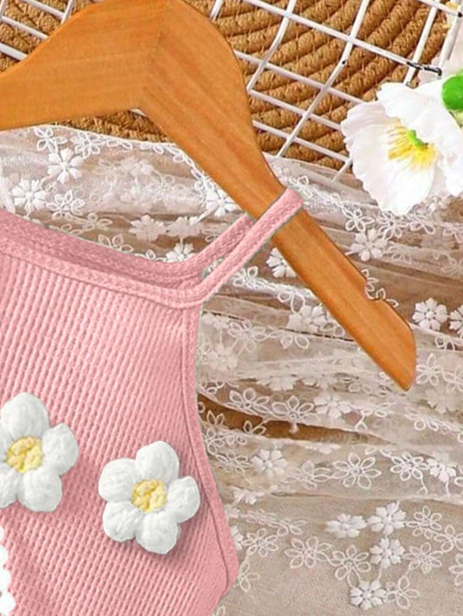 Girls' sleeveless summer midi dress with halter neckline, geometric pattern, applique and fringe details, shown with crossbody bag accessory with tassel decor