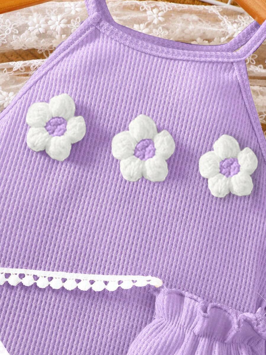 Girls' sleeveless summer midi dress with halter neckline, geometric pattern, applique and fringe details, shown with crossbody bag accessory with tassel decor