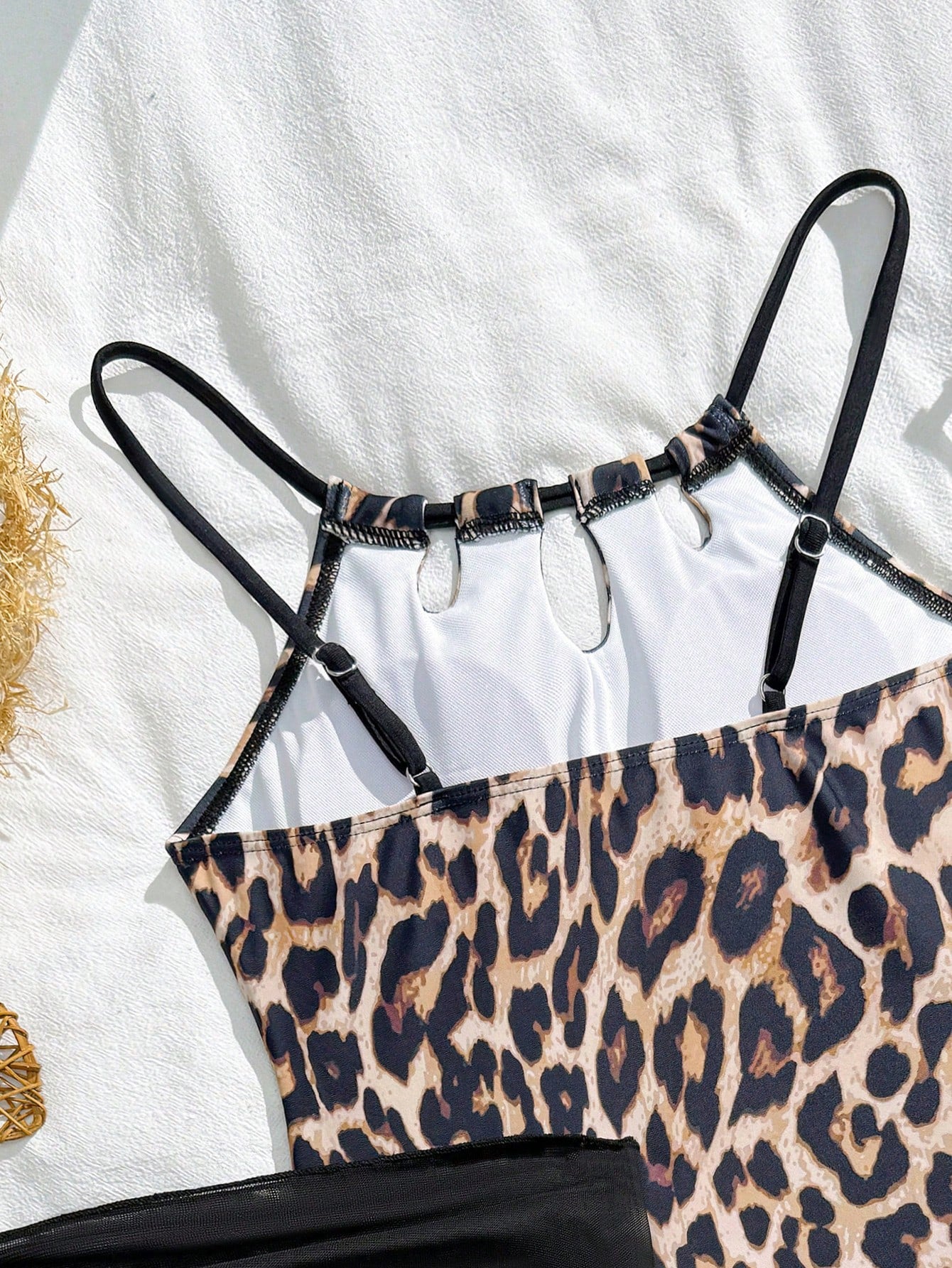 Girls black and white one-piece swimsuit set with cut-out detail, spaghetti straps, sleeveless fitted design, and matching skirt bottom for vacation swimwear.