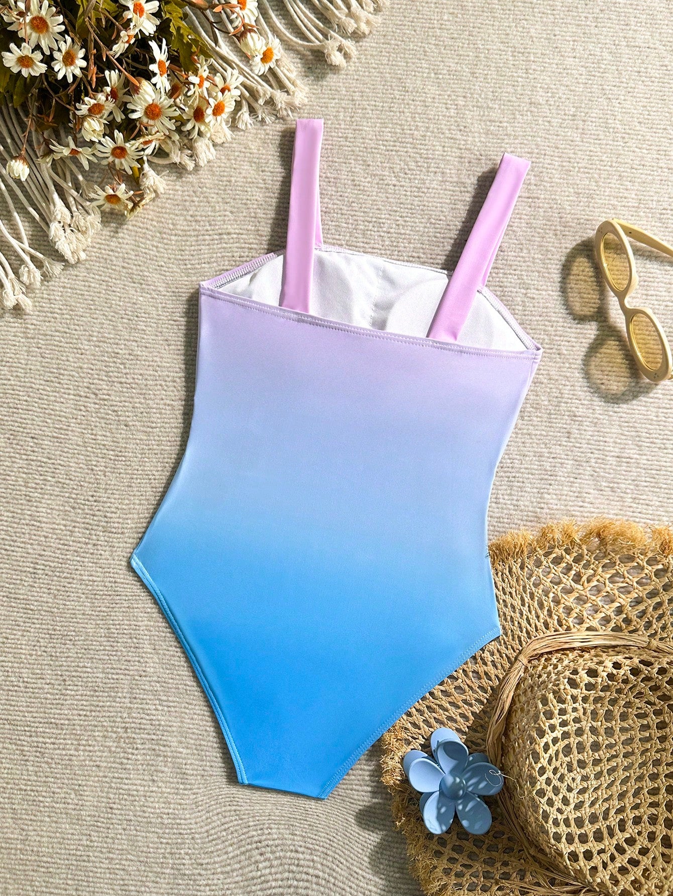 Tween girl multicolor ombre one-piece swimsuit with spaghetti straps, all-over print, lined body, and vacation beachwear style.