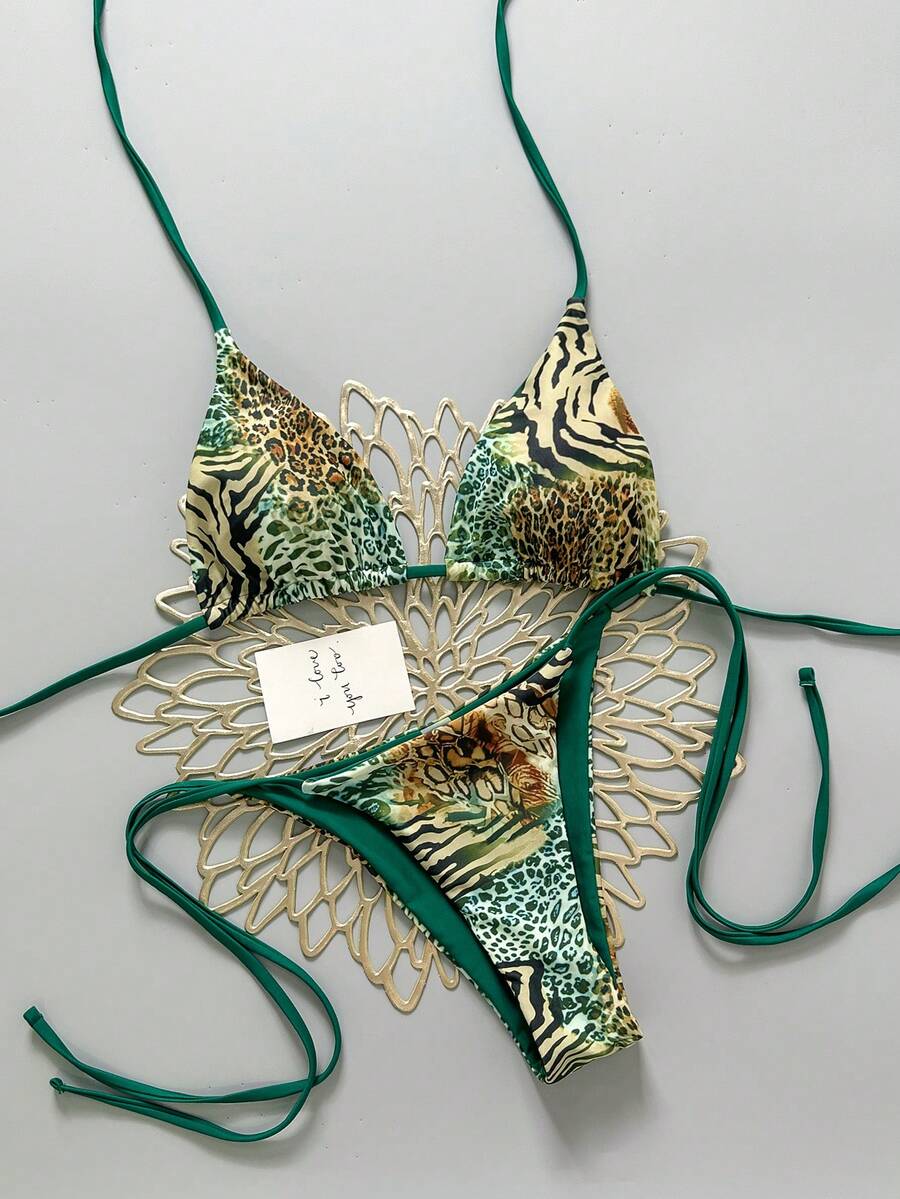 Women's vintage leopard print 2-piece bikini set featuring a high waist tie-side bottom and a halter neck triangle top.