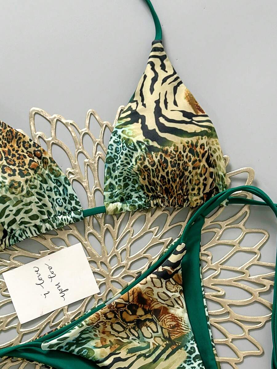 Women's vintage leopard print 2-piece bikini set featuring a high waist tie-side bottom and a halter neck triangle top.
