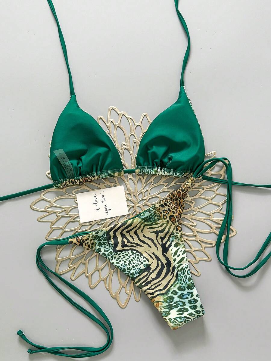 Women's vintage leopard print 2-piece bikini set featuring a high waist tie-side bottom and a halter neck triangle top.