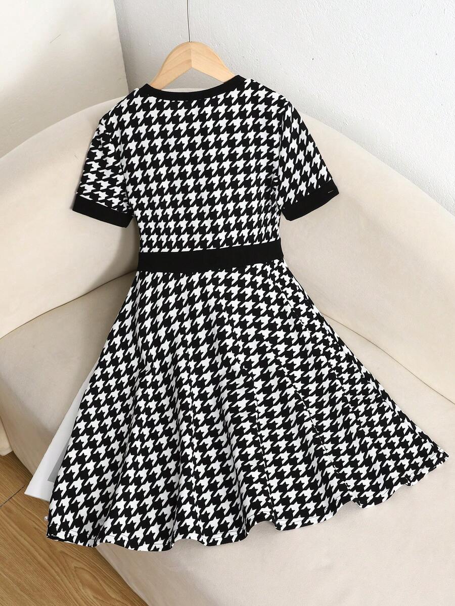 Nova Glow tween girls black and white houndstooth print short sleeve A-line dress with decorative buttons and crew neckline.