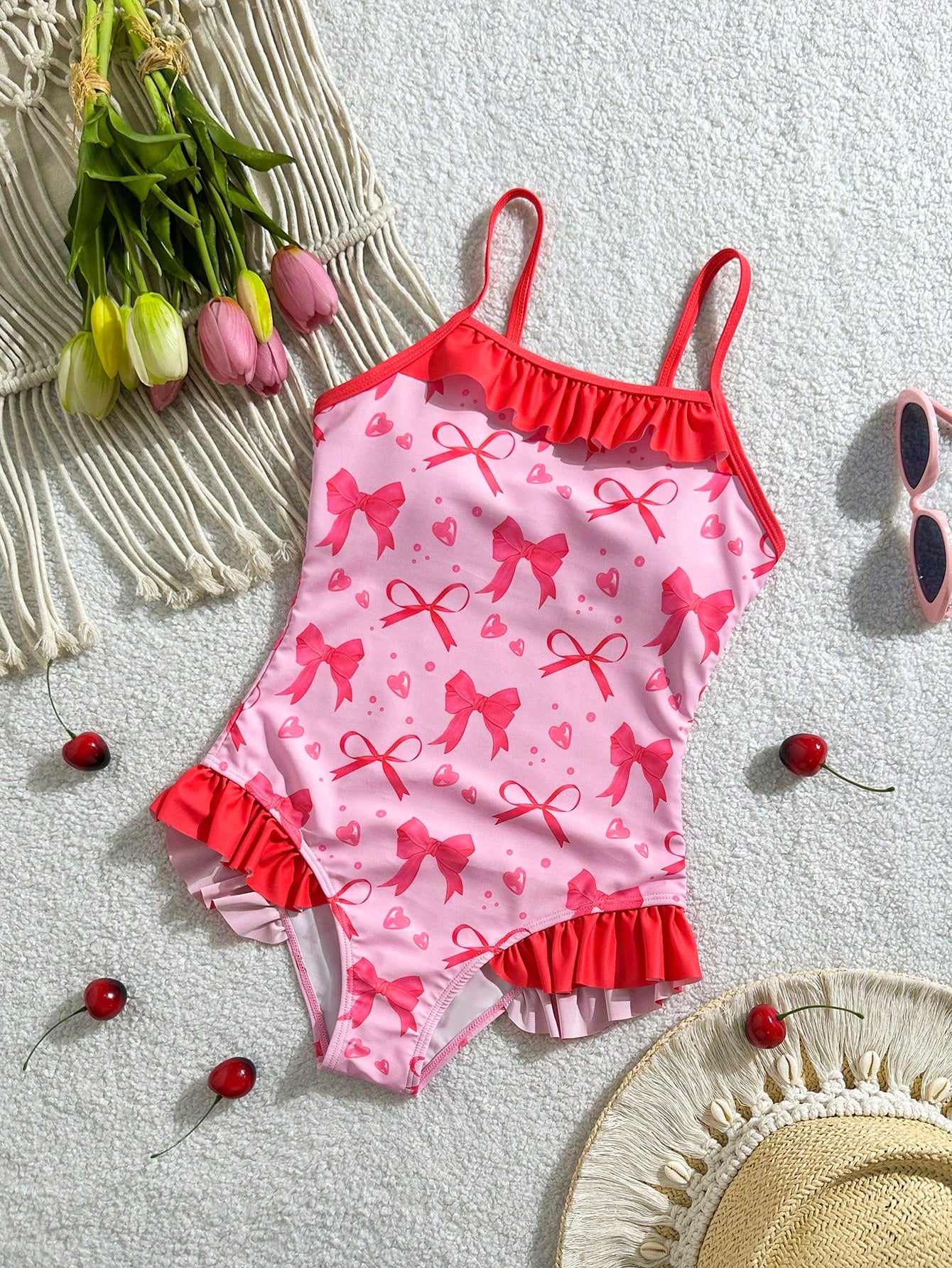 Tween girl plaid all-over print one-piece swimsuit with ruffle detail, spaghetti straps, fitted shape, and multicolor patchwork style for beach or pool wear.
