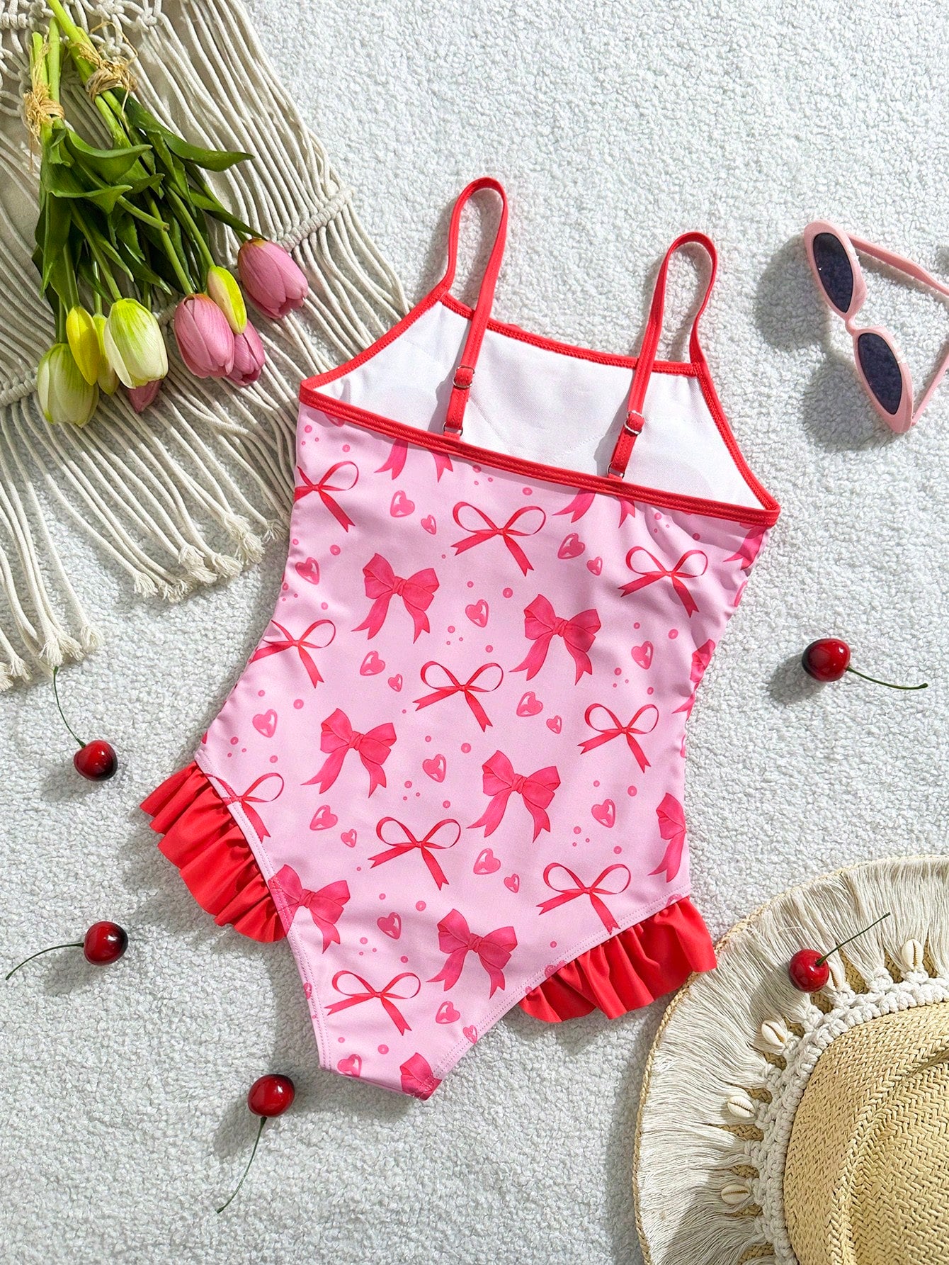 Tween girl plaid all-over print one-piece swimsuit with ruffle detail, spaghetti straps, fitted shape, and multicolor patchwork style for beach or pool wear.