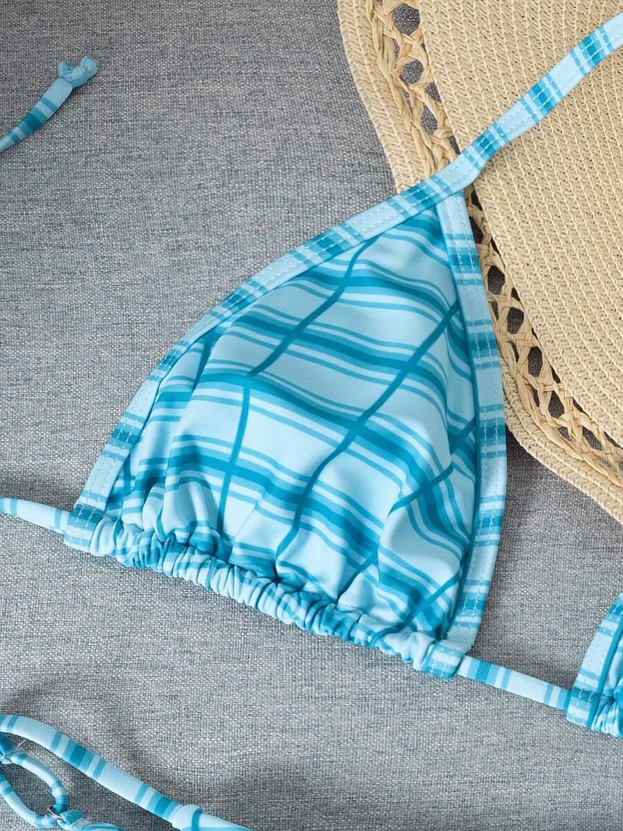 Multicolor bohemian bikini set for women featuring a backless halter top with knot details and high cut swimsuit bottoms.