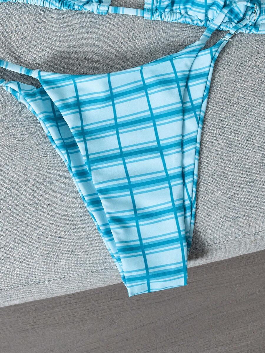 Multicolor bohemian bikini set for women featuring a backless halter top with knot details and high cut swimsuit bottoms.