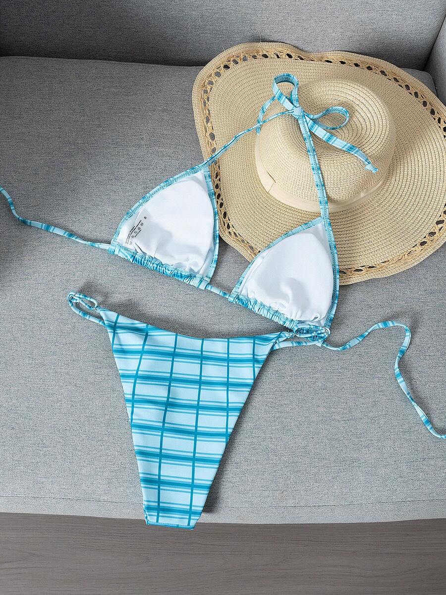 Multicolor bohemian bikini set for women featuring a backless halter top with knot details and high cut swimsuit bottoms.