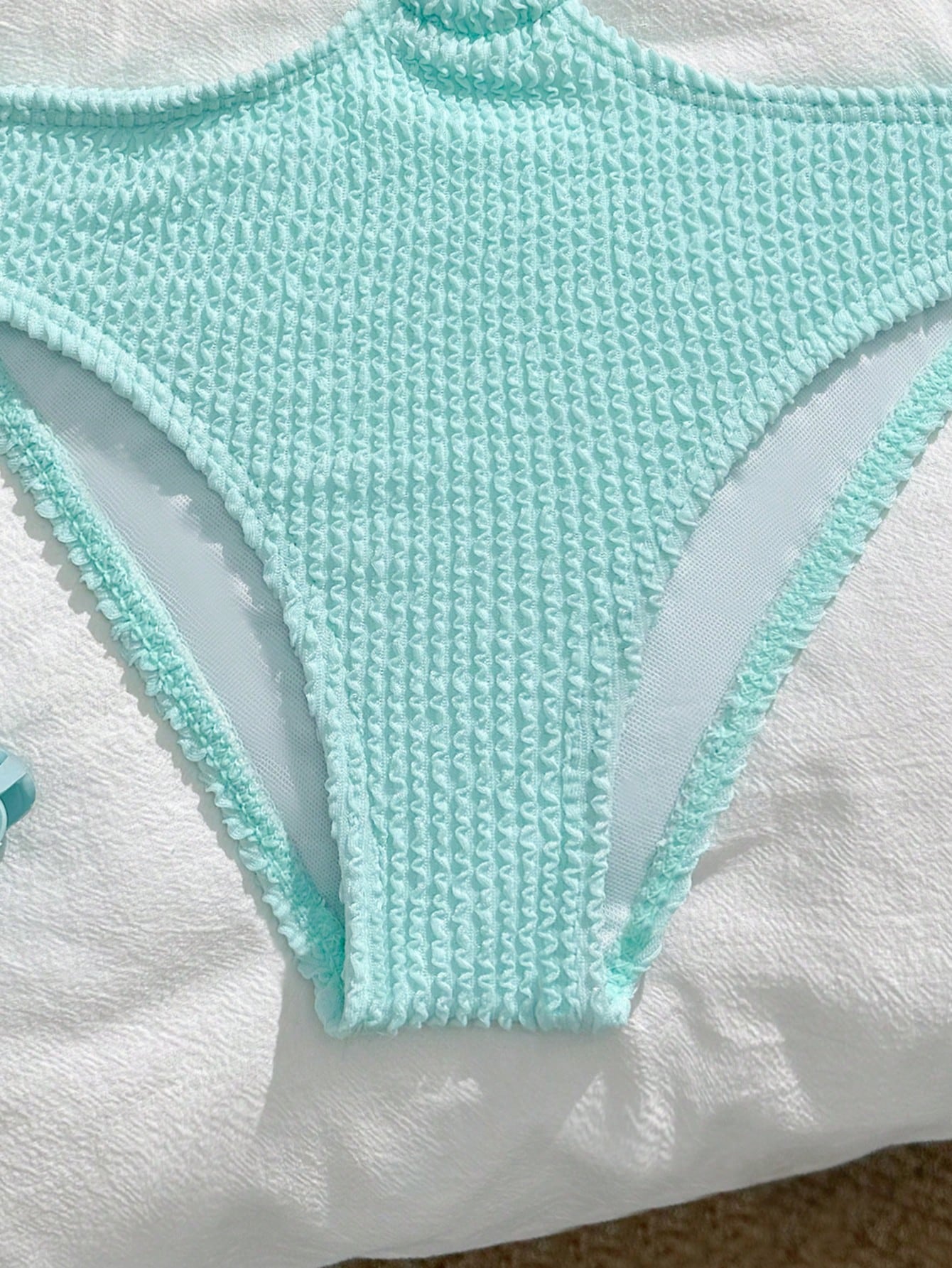 Mint blue tween girls one-piece swimsuit with asymmetrical neckline, cut-out detail, lined body, and high-stretch polyester blend fabric for vacation beachwear