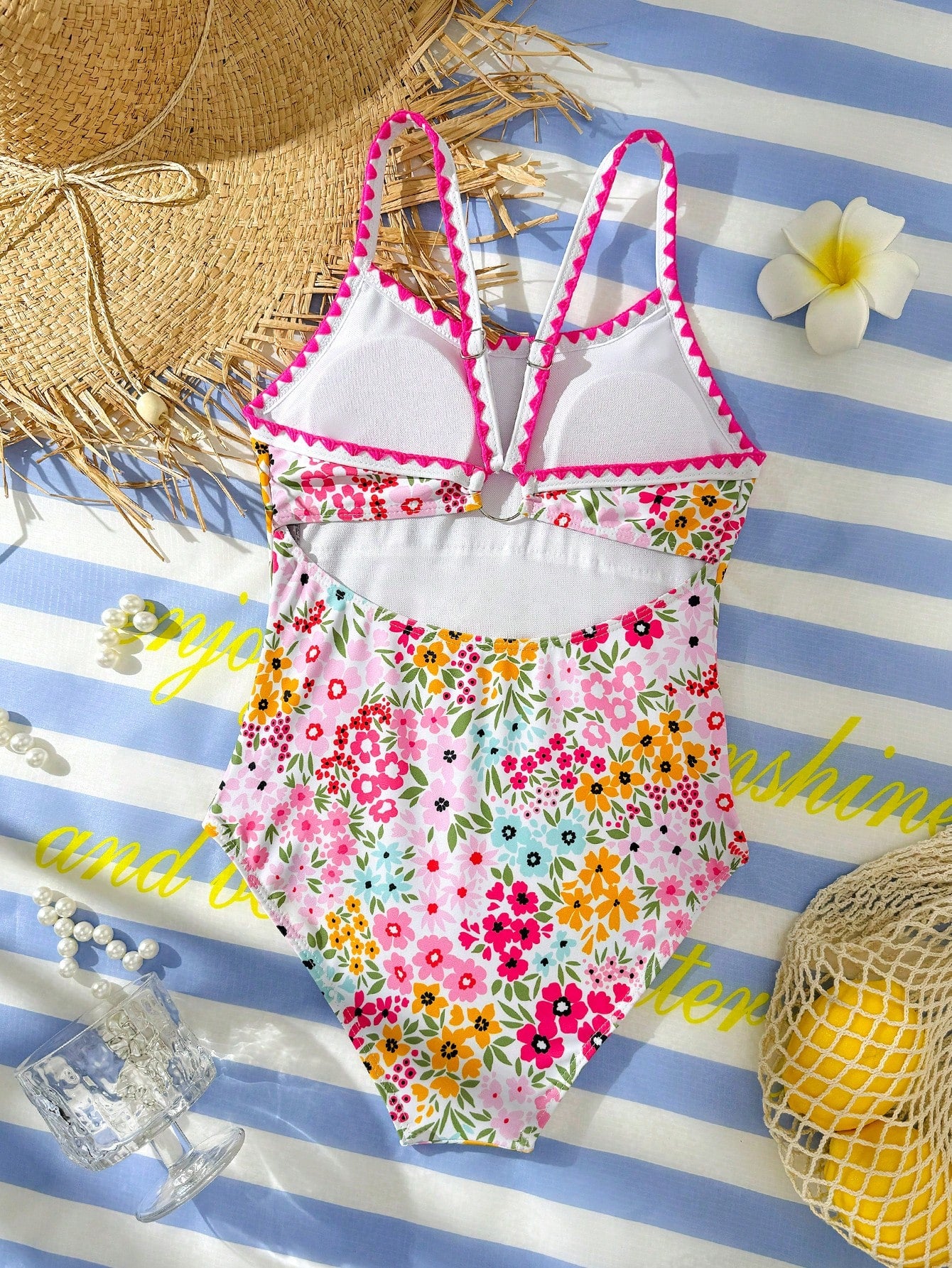 Tween girl one-piece swimsuit with floral plant print, asymmetrical neckline, cut-out detail, and fitted high-stretch design for beach and pool wear