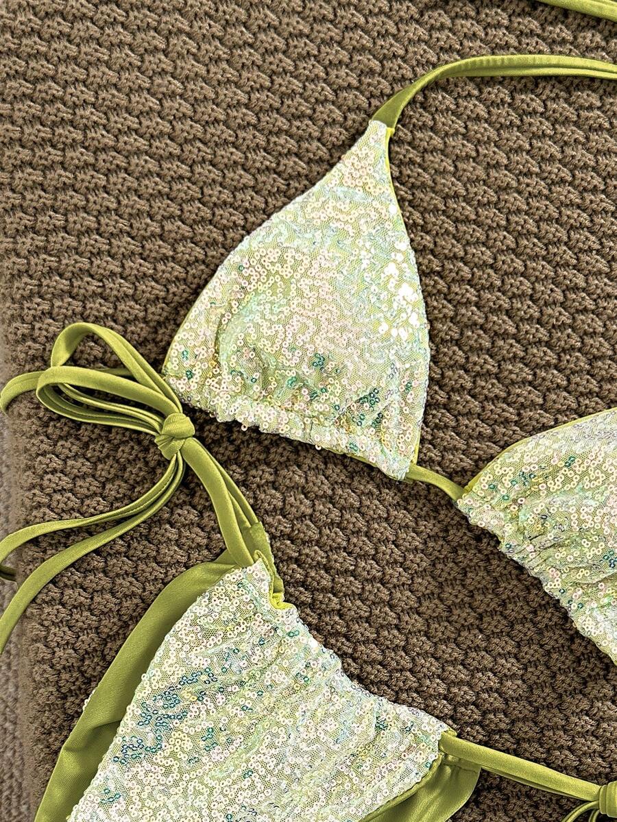 Women's apricot solid halter tie bikini top with triangle cups and matching tie-side swimsuit bottoms.