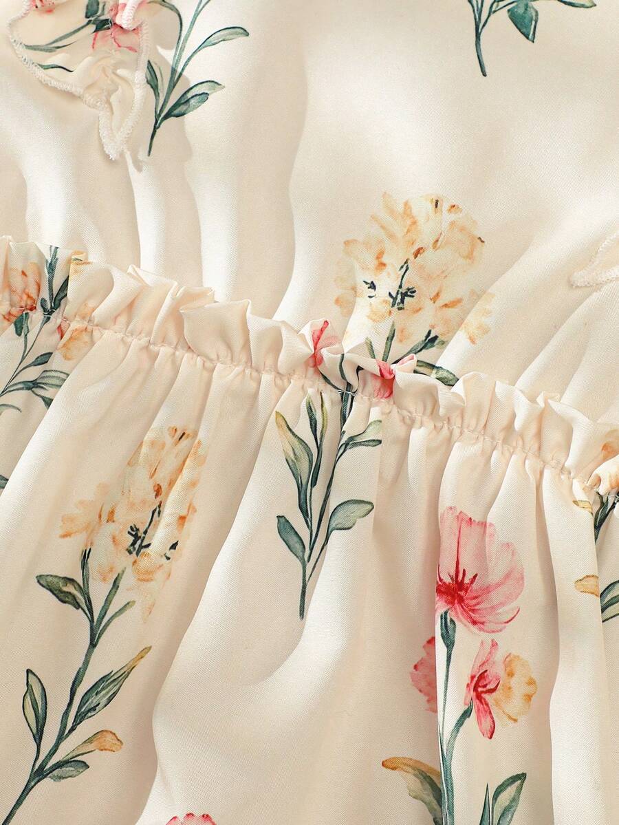 Girls sleeveless floral ruffle high waist A-line dress in champagne color with round neck and flounce hem.