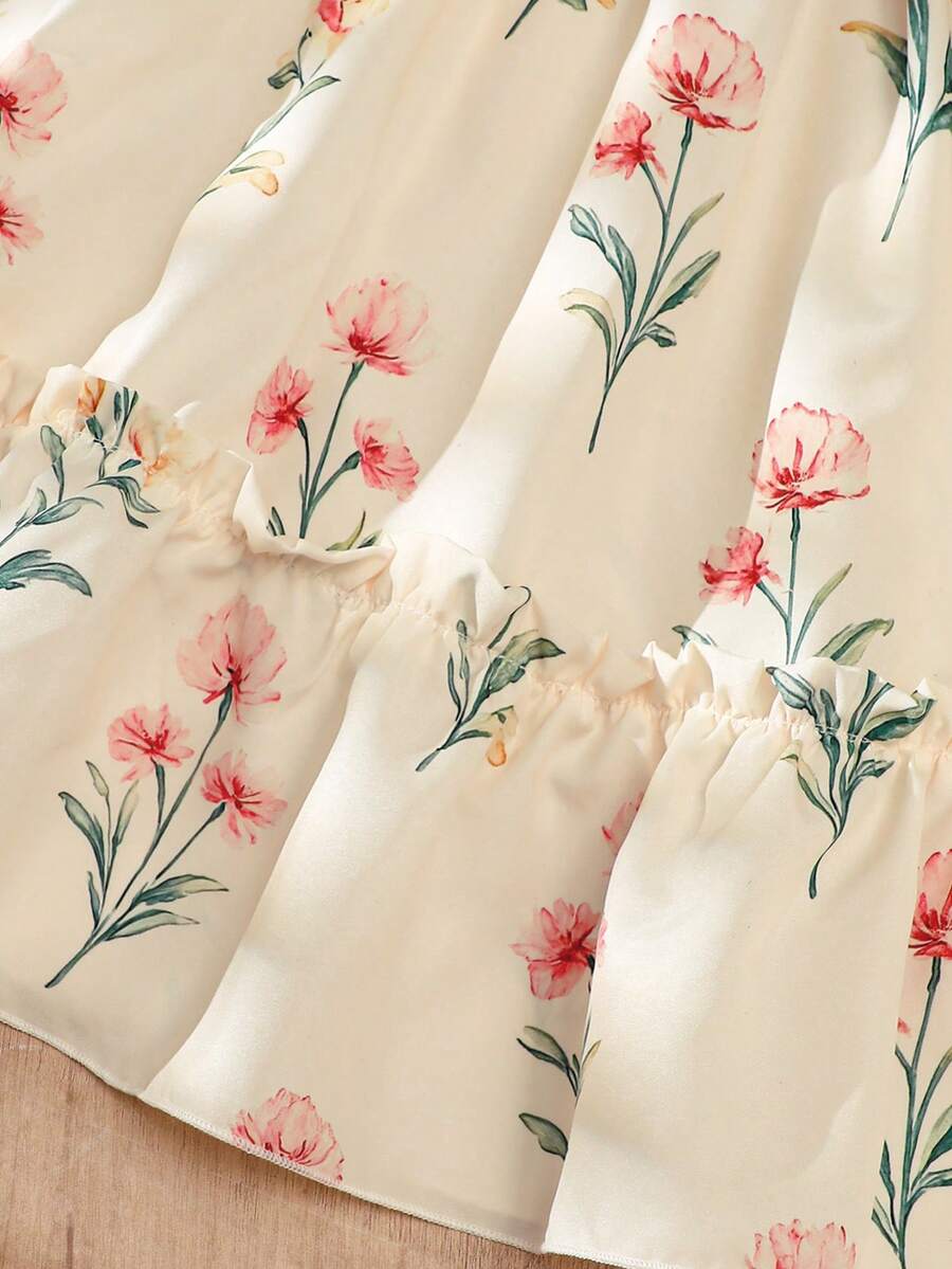 Girls sleeveless floral ruffle high waist A-line dress in champagne color with round neck and flounce hem.
