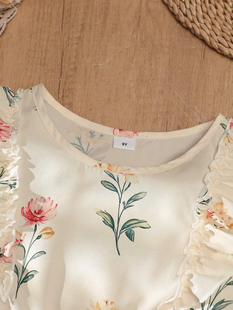 Girls sleeveless floral ruffle high waist A-line dress in champagne color with round neck and flounce hem.
