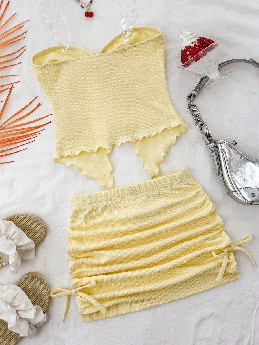Tween girls apricot two-piece set featuring a spaghetti strap tank top and skirt with ruched lettuce trim.