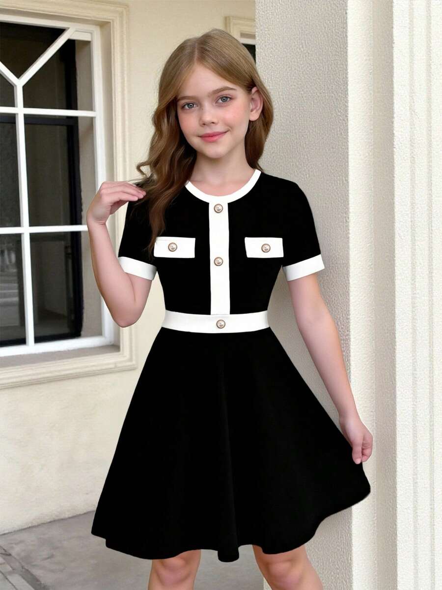 Nova Glow tween girls black and white houndstooth print short sleeve A-line dress with decorative buttons and crew neckline.