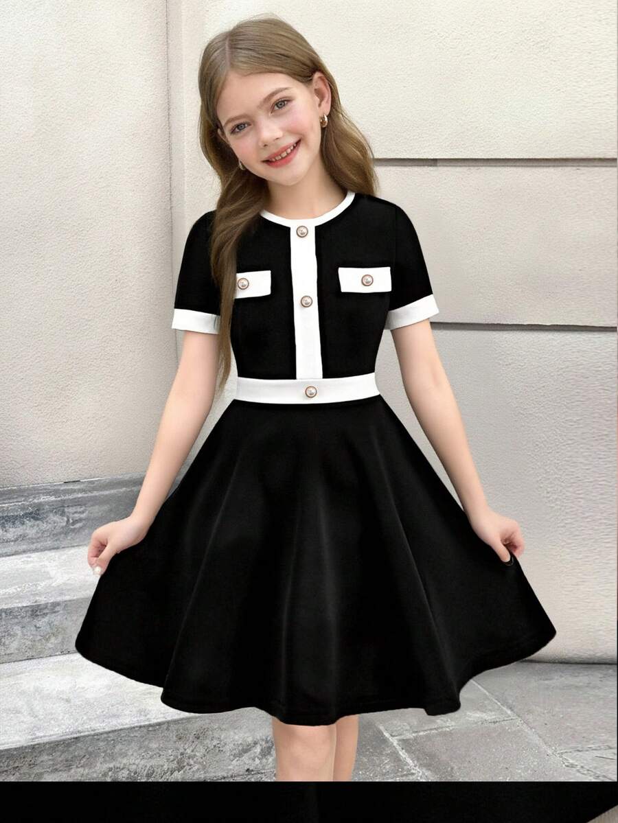 Nova Glow tween girls black and white houndstooth print short sleeve A-line dress with decorative buttons and crew neckline.
