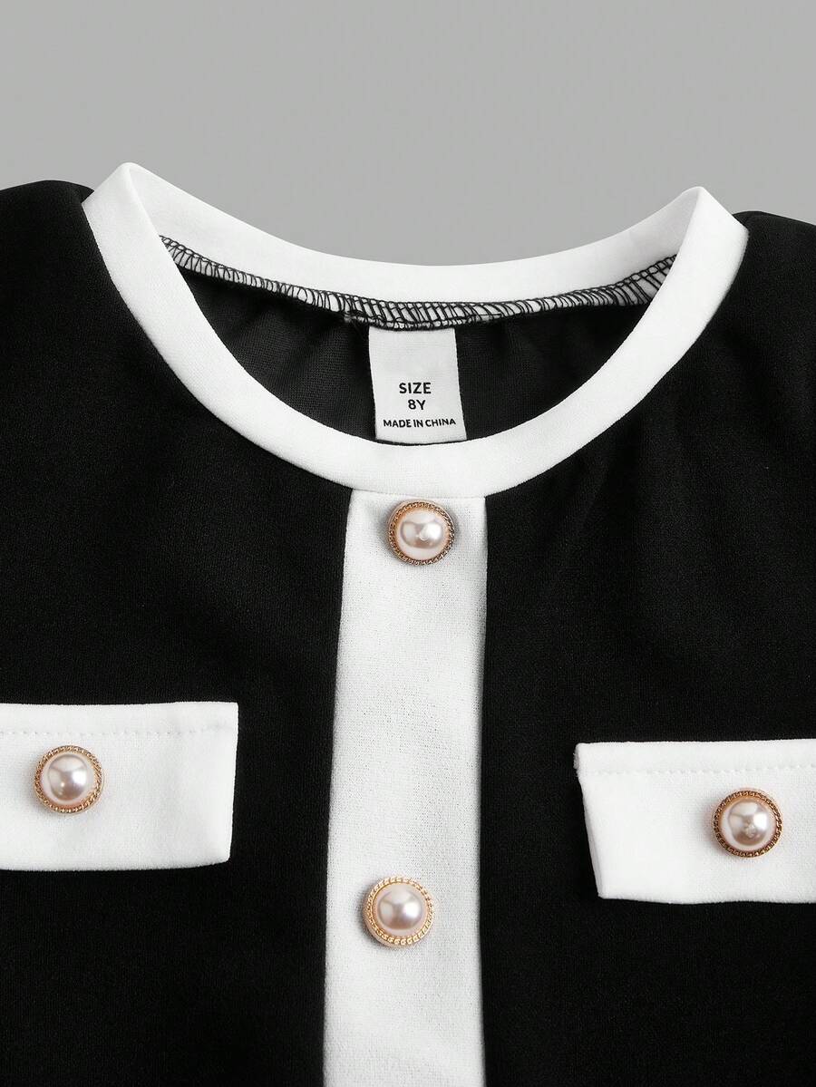 Nova Glow tween girls black and white houndstooth print short sleeve A-line dress with decorative buttons and crew neckline.