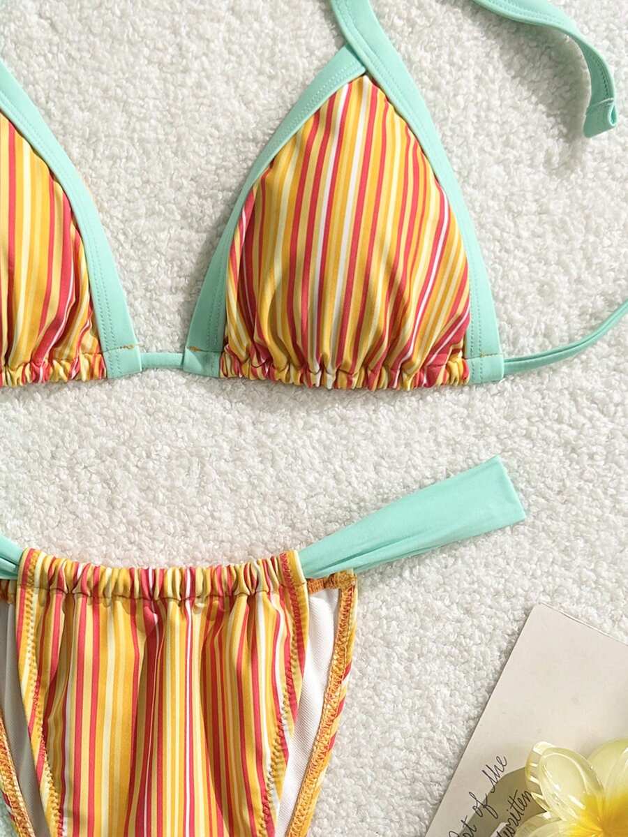 Orange striped 2-piece bikini swimsuit for women featuring a wireless spaghetti strap top with chain detail and high-waisted tie-side thong bottoms.