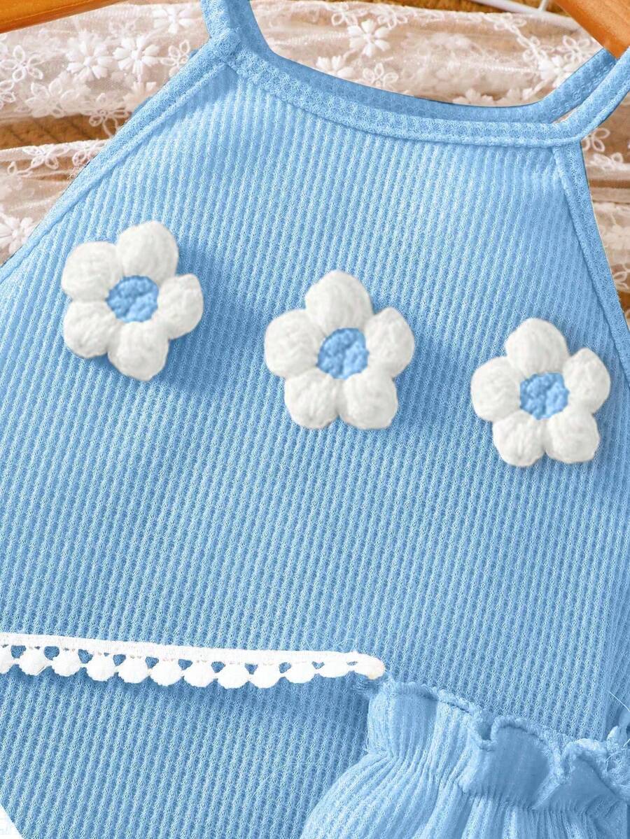 Girls' sleeveless summer midi dress with halter neckline, geometric pattern, applique and fringe details, shown with crossbody bag accessory with tassel decor