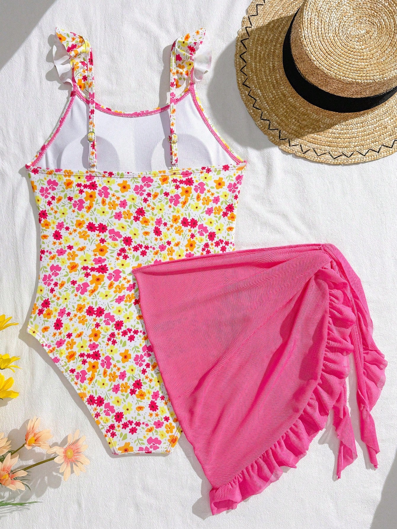 Tween girls one-piece swimsuit in leopard print with ruffle shoulder straps, scoop neckline, fitted shape, and attached ruffle hem skirt; sleeveless, mid-waist skirt bottom, and lined body for swimming, vacation, and summer beach wear.