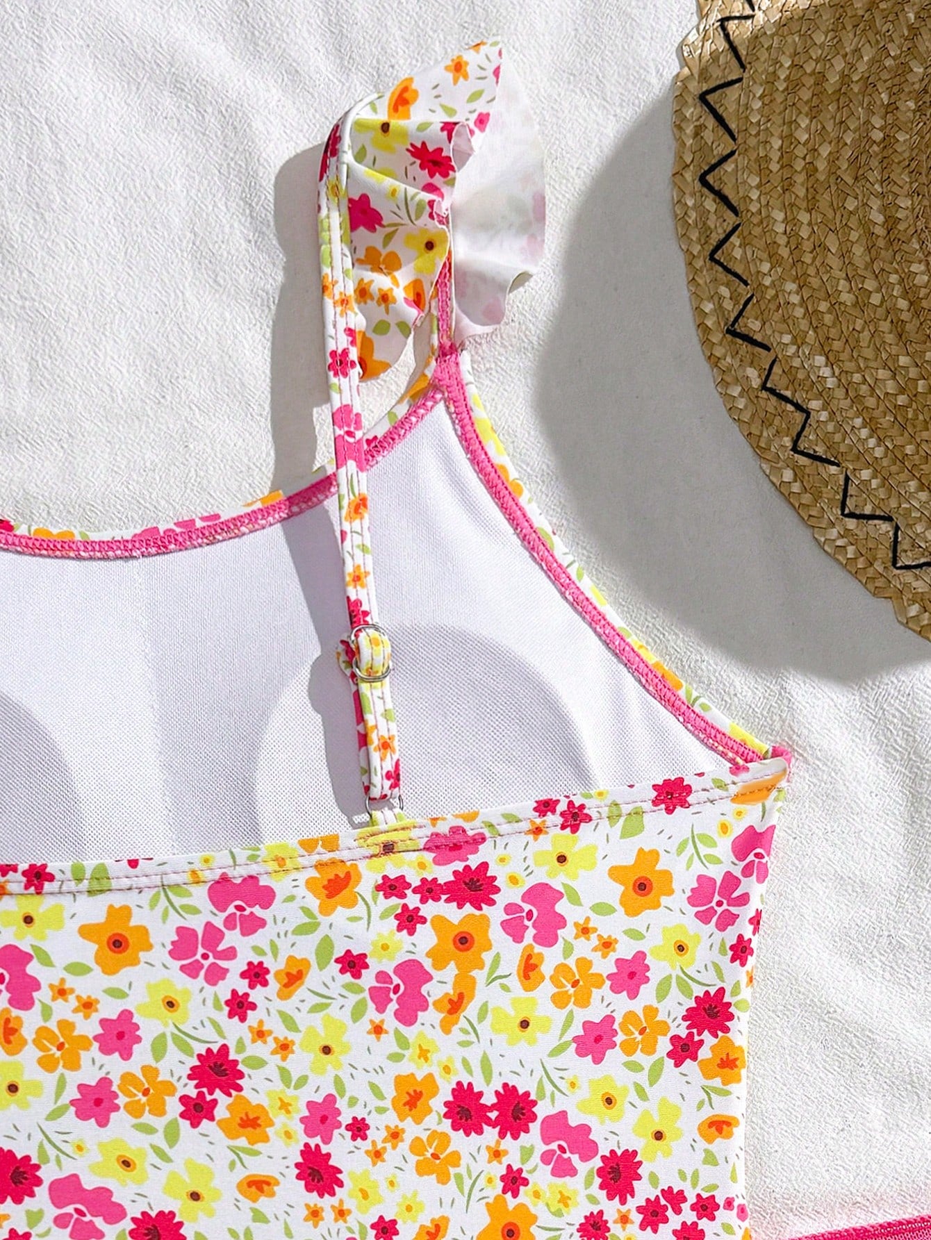 Tween girls one-piece swimsuit in leopard print with ruffle shoulder straps, scoop neckline, fitted shape, and attached ruffle hem skirt; sleeveless, mid-waist skirt bottom, and lined body for swimming, vacation, and summer beach wear.