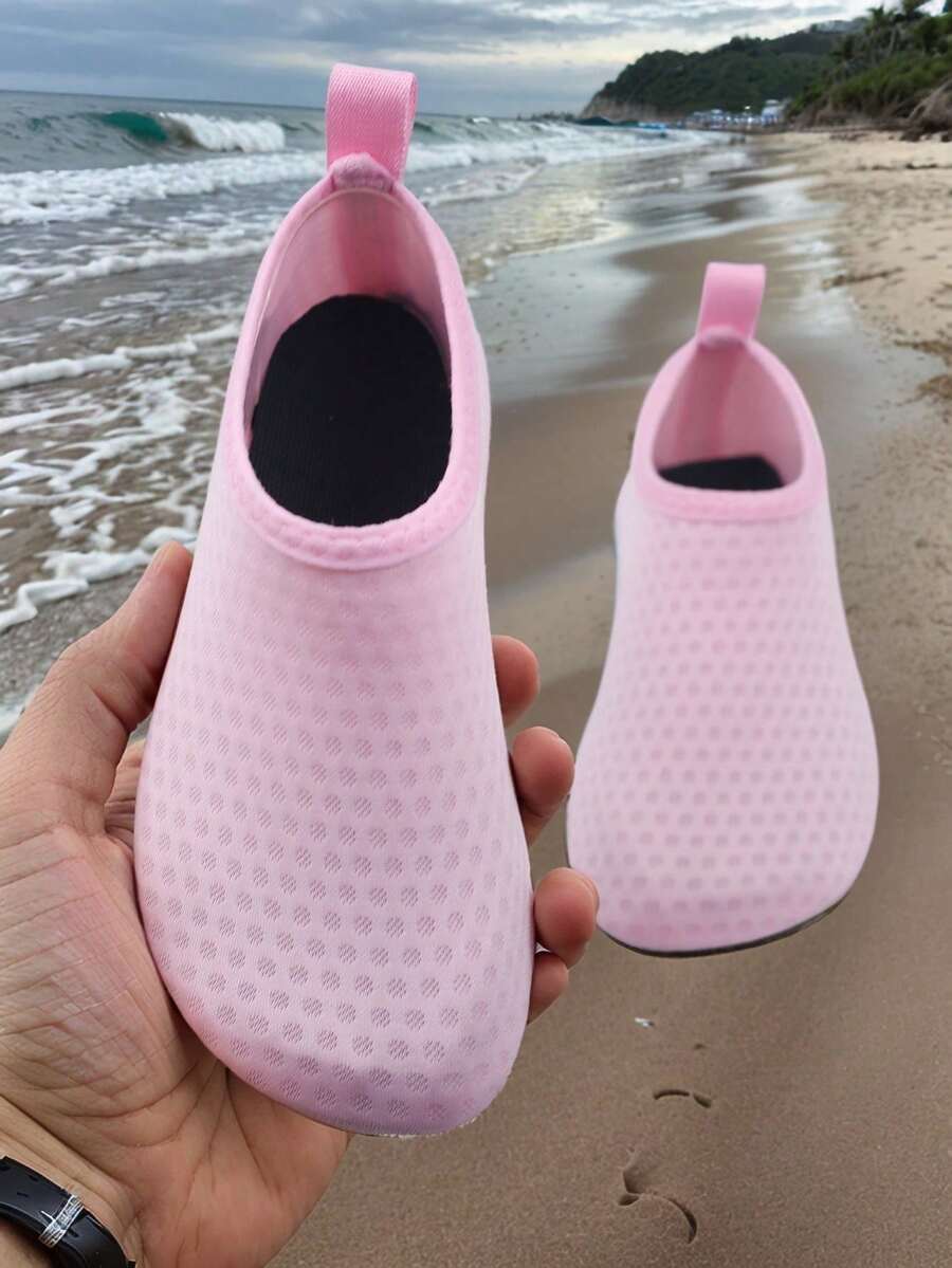 Kids slip-on aqua socks featuring geometric pattern, breathable Lycra upper, and non-slip TPR outsole for beach and water activities.