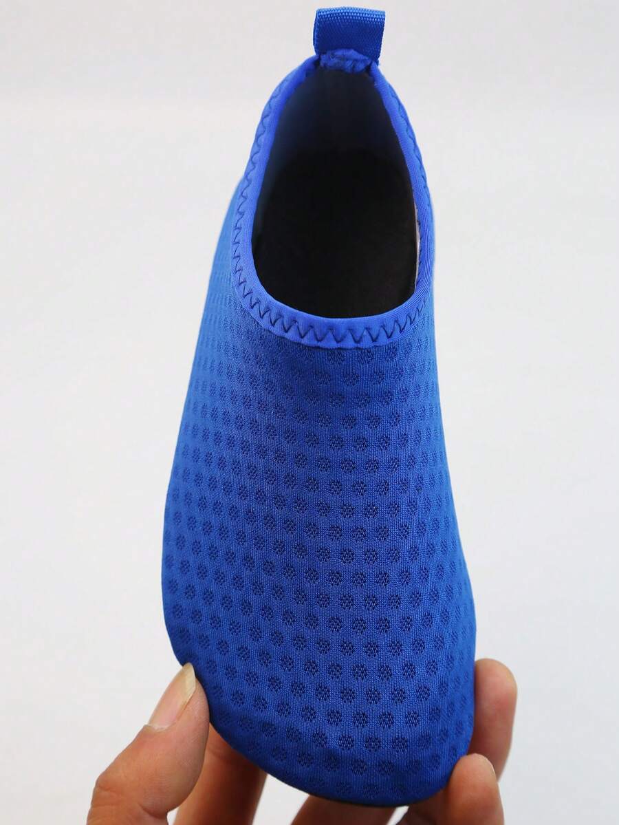 Kids slip-on aqua socks featuring geometric pattern, breathable Lycra upper, and non-slip TPR outsole for beach and water activities.