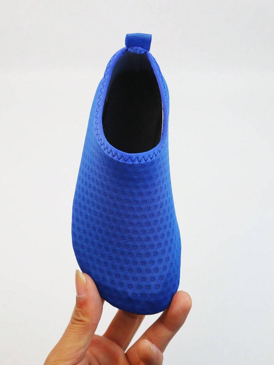 Kids slip-on aqua socks featuring geometric pattern, breathable Lycra upper, and non-slip TPR outsole for beach and water activities.