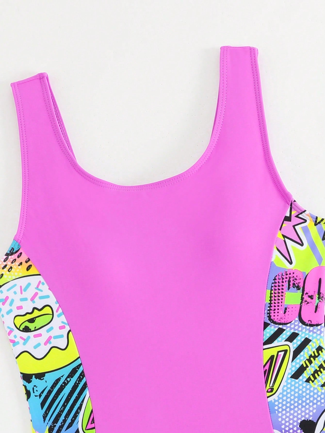 Tween girls 2-piece swimsuit set with a printed one-piece featuring ruffle trim, scoop neckline, cut-out detail, and matching shorts bottom.